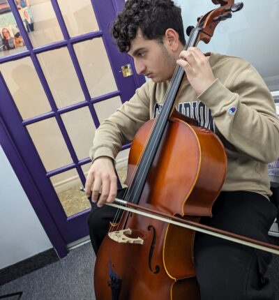 A Kid playing Cello